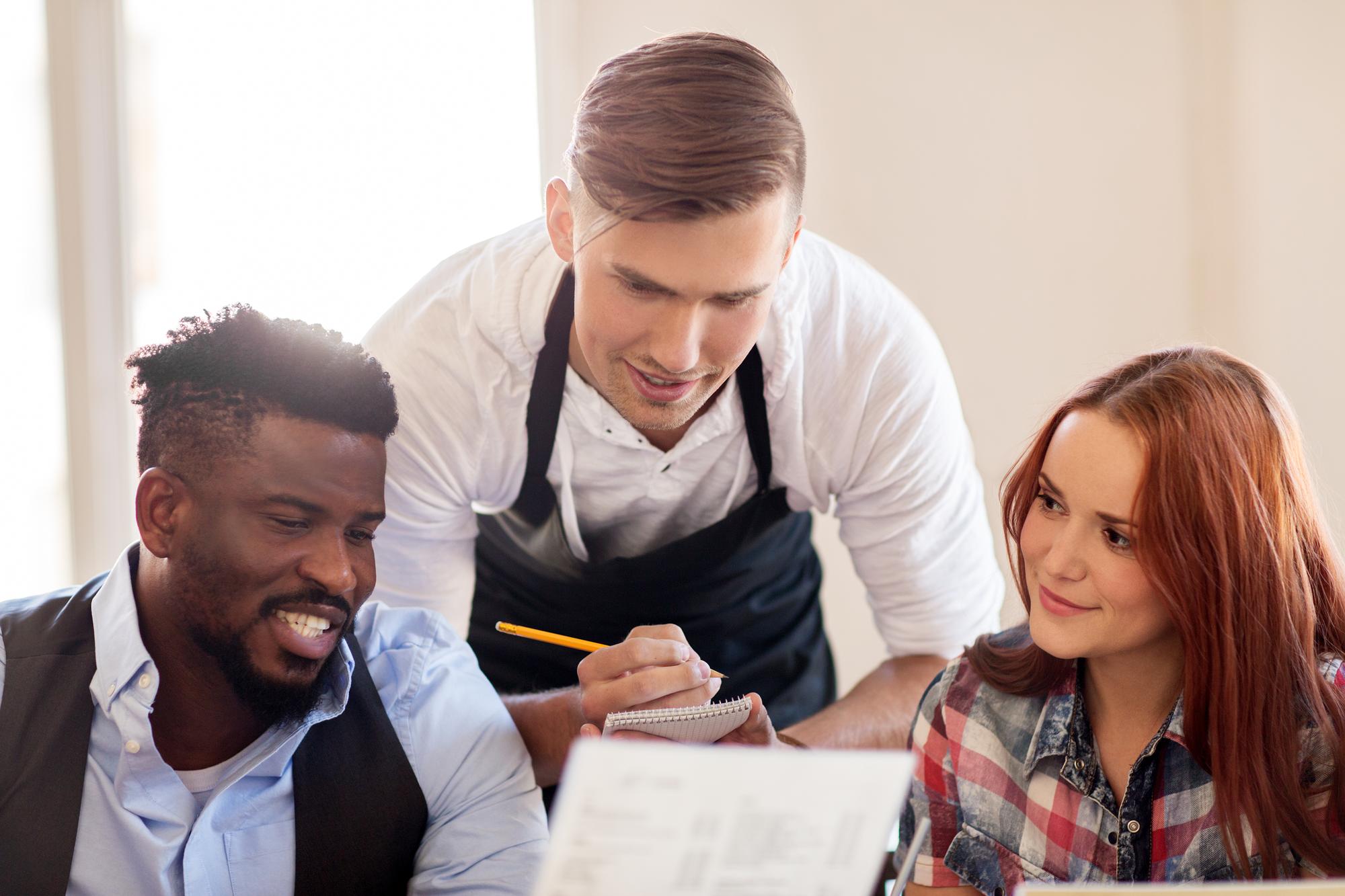Consultation session with chef reviewing menu notes